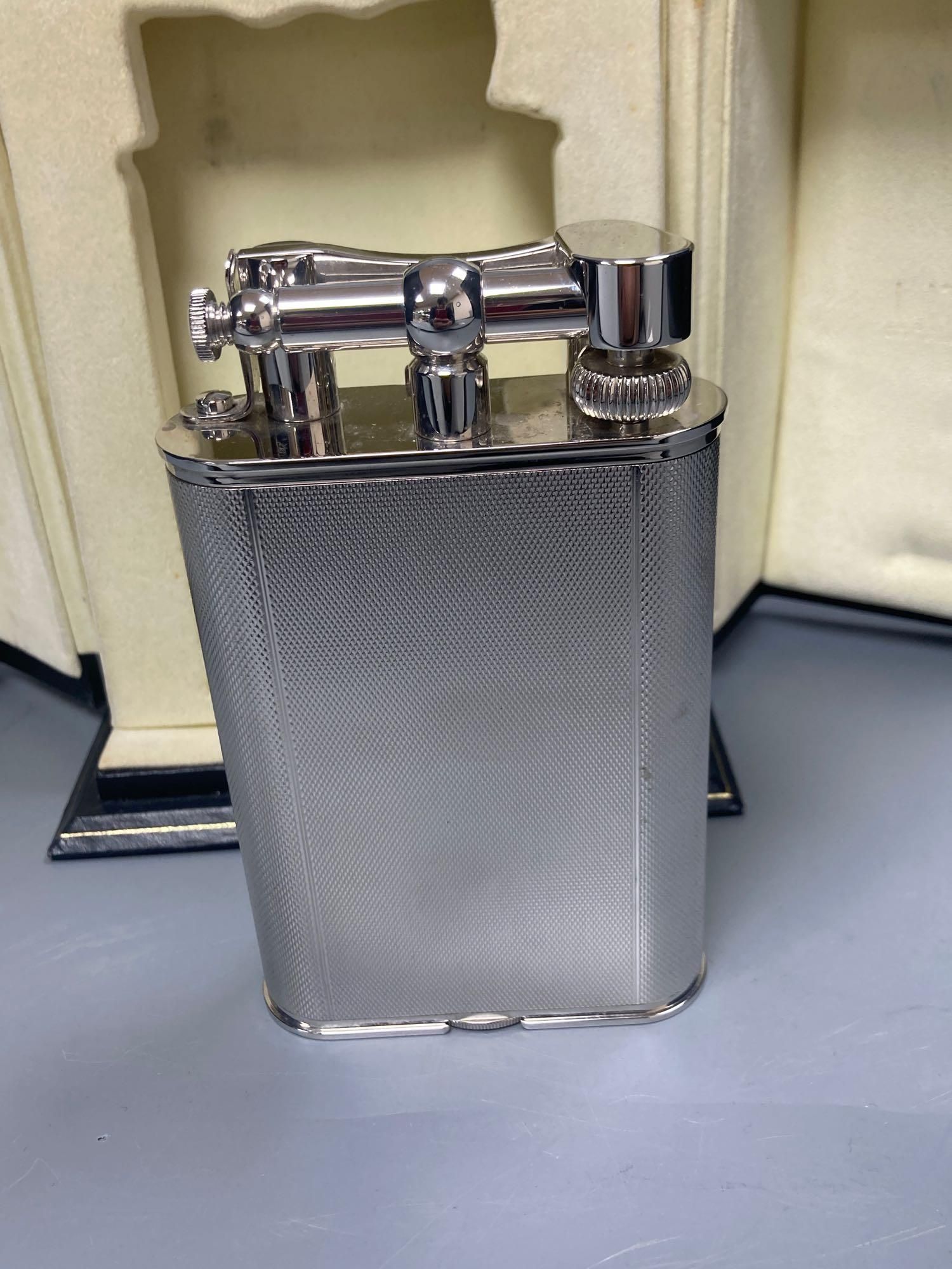 A Dunhill table lighter - Charlston, with timepiece